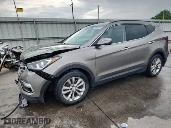 2018 Hyundai Santa Fe 2.0T with VIN 5XYZUDLA5JG549440, listed as a Copart auction lot 70559825 with 128,417 mi miles and Salvage title. Bid and sale history available at DreamBid. Image 1.