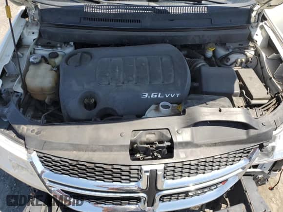 2014 Dodge Journey SXT with VIN 3C4PDDBGXET251543, listed as a Copart auction lot 63530895 with 107,709 mi miles and Salvage title. Bid and sale history available at DreamBid. Image 12.