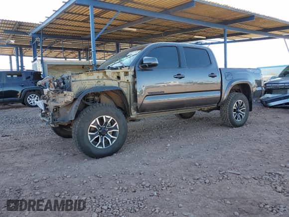 2020 Toyota Tacoma TRD Off Road с VIN 5TFCZ5AN0LX220213, выставлен на аукционе Copart как лот 82211705 с пробегом 72 977 миль миль и Списание • Salvage title. История ставок и продаж доступна на DreamBid. Изображение 1.