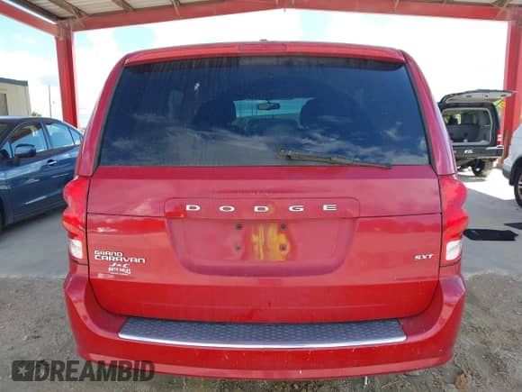2014 Dodge Grand Caravan SXT with VIN 2C4RDGCG4ER129711, listed as a IAAI auction lot 43317873 with 164,242 mi miles and . Bid and sale history available at DreamBid. Image 16.