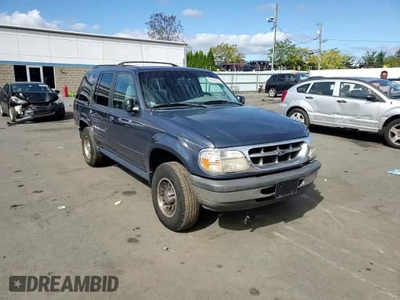1998 Ford Explorer XL z VIN 1FMZU34X5WZB03886, wystawiony jako Copart lot #84244475 z przebiegiem 159 121 mil mil oraz Szkoda całkowita • Salvage title. Historia ofert i sprzedaży dostępna na DreamBid. Obrazek 14.