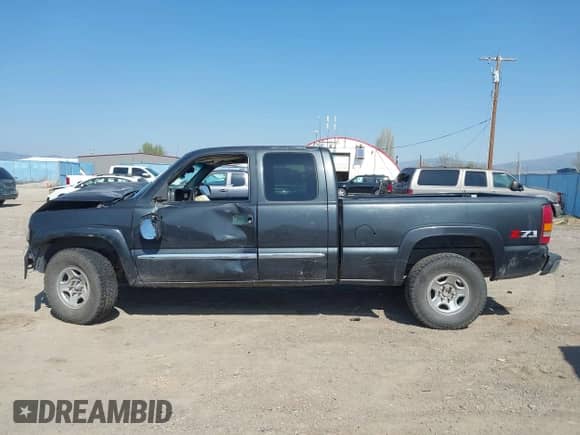 2003 GMC Sierra 1500 SLT z VIN 1GTEK19T03E191705, wystawiony jako IAAI lot #42145392 z przebiegiem Nie podano mil oraz . Historia ofert i sprzedaży dostępna na DreamBid. Obrazek 15.