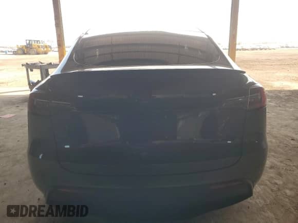 2021 Tesla Model Y Long Range with VIN 5YJYGDEE7MF206059, listed as a Copart auction lot 80559965 with 77,329 mi miles and Salvage title. Bid and sale history available at DreamBid. Image 6.