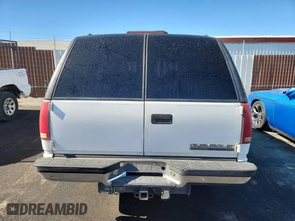 1996 Chevrolet Tahoe z VIN 1GNEC13R5TJ374784, wystawiony jako Copart lot #66554125 z przebiegiem 218 321 mil mil oraz Czysty tytuł • Clean title. Historia ofert i sprzedaży dostępna na DreamBid. Obrazek 6.