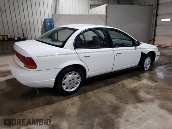 1997 Saturn SL с VIN 1G8ZK5272VZ252757, выставлен на аукционе Copart как лот 70937785 с пробегом 166 639 миль миль и Списание • Salvage title. История ставок и продаж доступна на DreamBid. Изображение 3.