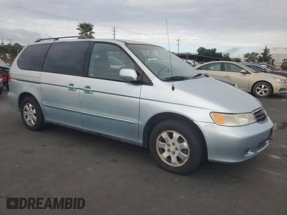 2003 Honda Odyssey EX с VIN 2HKRL18603H500941, выставлен на аукционе Copart как лот 86323335 с пробегом 94 045 миль миль и Чистый • Clean title. История ставок и продаж доступна на DreamBid. Изображение 4.