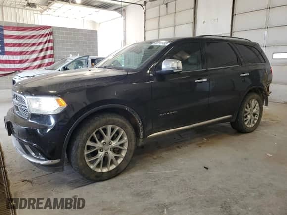 2014 Dodge Durango Citadel with VIN 1C4RDJEG1EC345292, listed as a Copart auction lot 80712465 with 124,016 mi miles and Salvage title. Bid and sale history available at DreamBid. Image 1.
