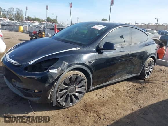 2022 Tesla Model Y Performance with VIN 7SAYGDEF7NF516418, listed as a IAAI auction lot 43222998 with 26,525 mi miles and . Bid and sale history available at DreamBid. Image 2.