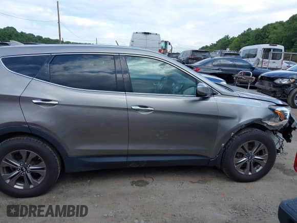 2015 Hyundai Santa Fe with VIN 5XYZTDLBXFG247970, listed as a IAAI auction lot 43030357 with 96,090 mi miles and . Bid and sale history available at DreamBid. Image 14.