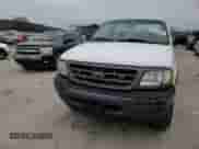 2003 Ford F-150 XL z VIN 1FTRF18W03NA77544, wystawiony jako Copart lot #84805894 z przebiegiem Nie podano mil oraz Szkoda całkowita • Salvage title. Historia ofert i sprzedaży dostępna na DreamBid. Obrazek 11.