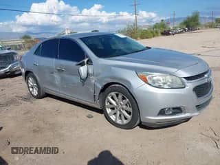 2016 Chevrolet Malibu LTZ z VIN 1G11E5SAXGF141926, wystawiony jako IAAI lot #43263595 z przebiegiem 141 156 mil mil oraz . Historia ofert i sprzedaży dostępna na DreamBid. Obrazek 1.