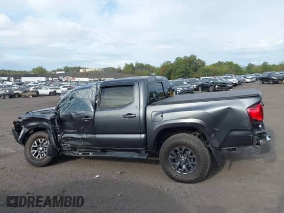 2021 Toyota Tacoma SR with VIN 3TMCZ5AN7MM383352, listed as a IAAI auction lot 43246296 with 44,937 mi miles and . Bid and sale history available at DreamBid. Image 14.