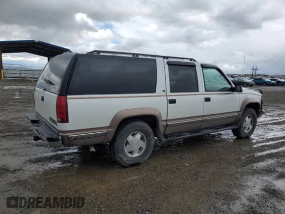 1996 Chevrolet Suburban с VIN 1GNFK16R5TJ316550, выставлен на аукционе Copart как лот 56913175 с пробегом 202 840 миль миль и Чистый • Clean title. История ставок и продаж доступна на DreamBid. Изображение 3.