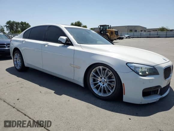 2014 BMW 7 Series 740Li с VIN WBAYE4C56ED138402, выставлен на аукционе Copart как лот 59127205 с пробегом 103 829 миль миль и Списание • Salvage title. История ставок и продаж доступна на DreamBid. Изображение 4.