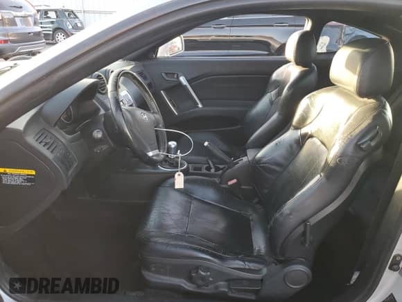 2004 Hyundai Tiburon GT с VIN KMHHN65F34U130594, выставлен на аукционе Copart как лот 75929784 с пробегом 118 836 миль миль и Списание • Salvage title. История ставок и продаж доступна на DreamBid. Изображение 7.