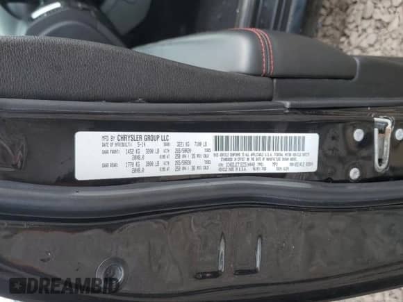 2014 Dodge Durango R/T z VIN 1C4SDJCT1EC514440, wystawiony jako Copart lot #82189825 z przebiegiem 172 833 mil mil oraz Szkoda całkowita • Salvage title. Historia ofert i sprzedaży dostępna na DreamBid. Obrazek 13.