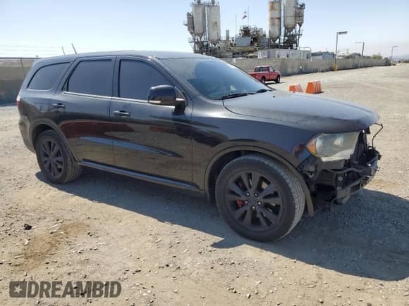 2012 Dodge Durango R/T with VIN 1C4SDHCT0CC362091, listed as a Copart auction lot 61875225 with 104,159 mi miles and Salvage title. Bid and sale history available at DreamBid. Image 4.
