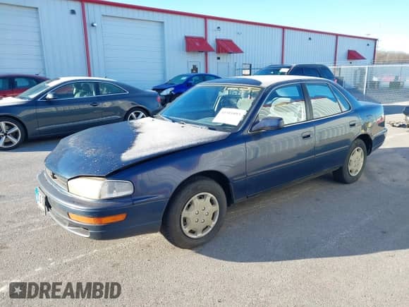 1994 Toyota Camry LE z VIN 4T1SK12EXRU374215, wystawiony jako IAAI lot #41581093 z przebiegiem 80 397 mil mil oraz . Historia ofert i sprzedaży dostępna na DreamBid. Obrazek 17.