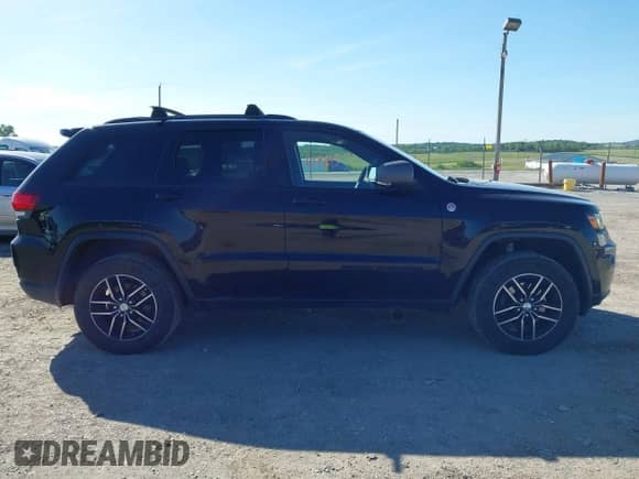 2017 Jeep Grand Cherokee Trailhawk with VIN 1C4RJFLG5HC841869, listed as a IAAI auction lot 42296985 with 103,275 mi miles and . Bid and sale history available at DreamBid. Image 13.
