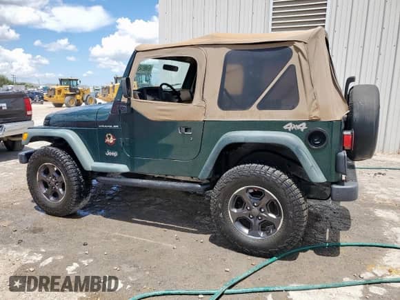 2000 Jeep Wrangler SE with VIN 1J4FA29P2YP800721, listed as a Copart auction lot 67490145 with 128,182 mi miles and Clean title. Bid and sale history available at DreamBid. Image 2.