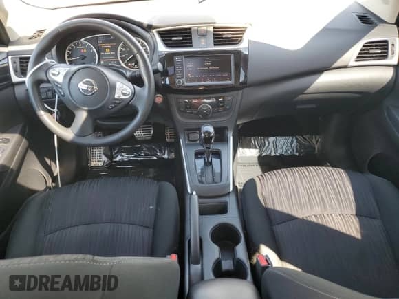 2019 Nissan Sentra S с VIN 3N1AB7APXKY453007, выставлен на аукционе Copart как лот 85601315 с пробегом 56 254 миль миль и Списание • Salvage title. История ставок и продаж доступна на DreamBid. Изображение 8.