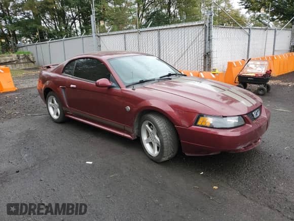 2004 Ford Mustang Standard z VIN 1FAFP40484F109752, wystawiony jako Copart lot #84595275 z przebiegiem 60 910 mil mil oraz Szkoda całkowita • Salvage title. Historia ofert i sprzedaży dostępna na DreamBid. Obrazek 4.