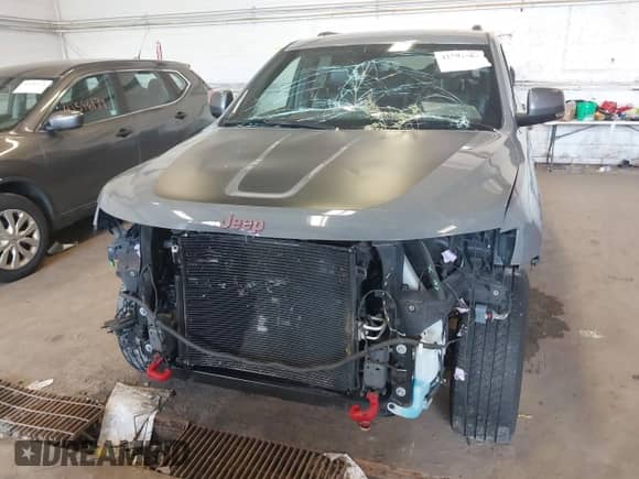 2020 Jeep Grand Cherokee Trailhawk with VIN 1C4RJFLG6LC101899, listed as a IAAI auction lot 42592283 with 116,619 mi miles and . Bid and sale history available at DreamBid. Image 6.