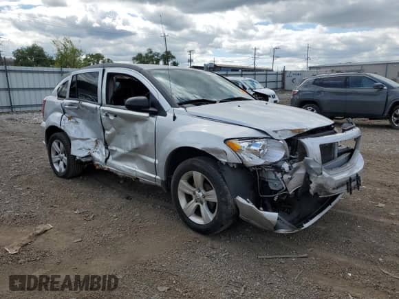 2010 Dodge Caliber Mainstreet with VIN 1B3CB3HA4AD542591, listed as a Copart auction lot 70044515 with Not provided miles and Salvage title. Bid and sale history available at DreamBid. Image 4.