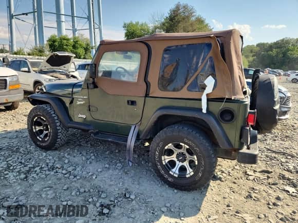 1997 Jeep Wrangler Sport with VIN 1J4FY19S0VP430844, listed as a Copart auction lot 65827275 with 91,868 mi miles and Salvage title. Bid and sale history available at DreamBid. Image 2.