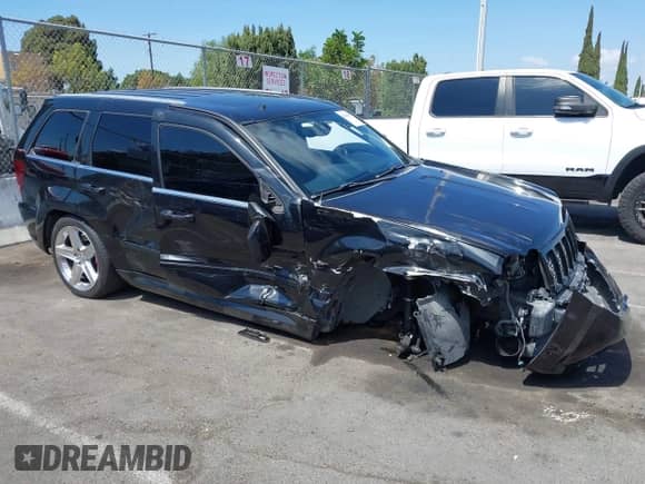 2009 Jeep Grand Cherokee with VIN 1J8HR78W89C520526, listed as a IAAI auction lot 43193483 with 102,738 mi miles and . Bid and sale history available at DreamBid. Image 14.