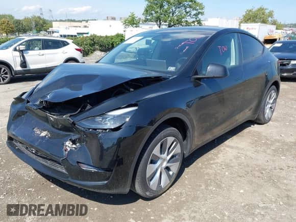2023 Tesla Model Y Long Range z VIN 7SAYGDEE0PA201841, wystawiony jako IAAI lot #43158634 z przebiegiem 10 356 mil mil oraz . Historia ofert i sprzedaży dostępna na DreamBid. Obrazek 2.