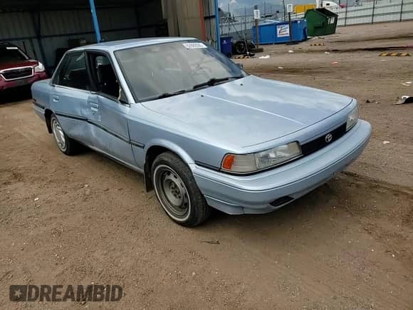 1991 Toyota Camry DLX z VIN 4T1SV21EXMU352321, wystawiony jako Copart lot #62889595 z przebiegiem 171 990 mil mil oraz Czysty tytuł • Clean title. Historia ofert i sprzedaży dostępna na DreamBid. Obrazek 13.