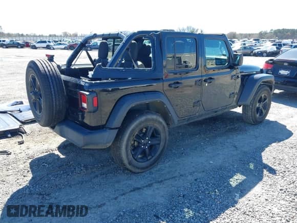 2021 Jeep Wrangler Unlimited Sport S with VIN 1C4HJXDG4MW753159, listed as a IAAI auction lot 41723515 with 86,589 mi miles and . Bid and sale history available at DreamBid. Image 4.