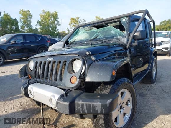 2011 Jeep Wrangler Sahara with VIN 1J4AA5D10BL511947, listed as a IAAI auction lot 43227627 with 168,984 mi miles and . Bid and sale history available at DreamBid. Image 16.