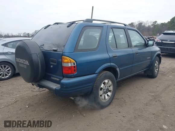 2000 Honda Passport LX with VIN 4S6DM58WXY4414843, listed as a IAAI auction lot 41325250 with 100,909 mi miles and . Bid and sale history available at DreamBid. Image 4.