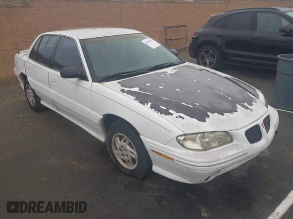 1998 Pontiac Grand Am SE with VIN 1G2NE52T7WM513702, listed as a IAAI auction lot 41503141 with 302,315 mi miles and . Bid and sale history available at DreamBid. Image 1.