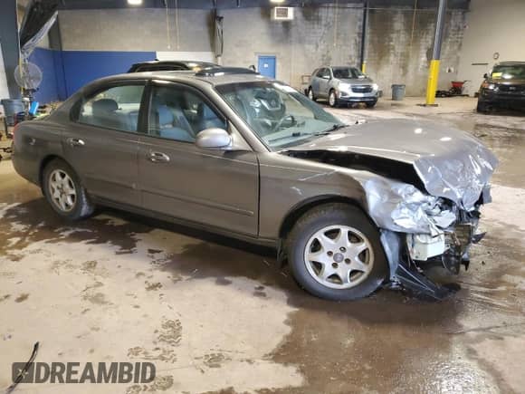 2001 Hyundai Sonata GLS z VIN KMHWF35V61A465100, wystawiony jako Copart lot #58200475 z przebiegiem 86 066 mil mil oraz Szkoda całkowita • Salvage title. Historia ofert i sprzedaży dostępna na DreamBid. Obrazek 4.