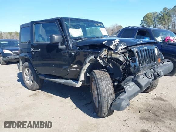 2012 Jeep Wrangler Sahara z VIN 1C4GJWBGXCL104006, wystawiony jako IAAI lot #41470054 z przebiegiem 148 472 mil mil oraz . Historia ofert i sprzedaży dostępna na DreamBid. Obrazek 1.