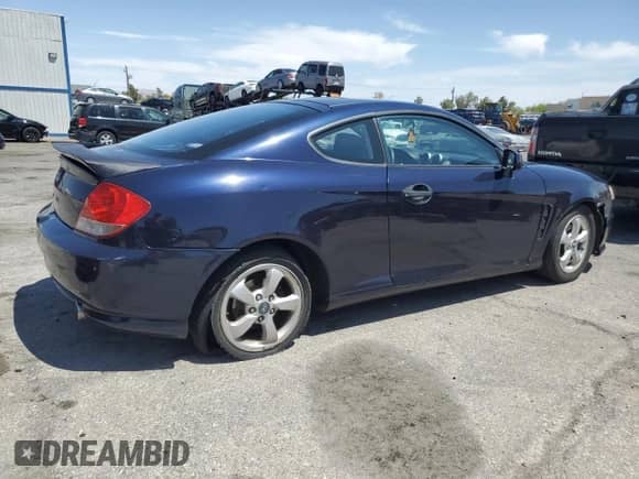 2006 Hyundai Tiburon GS с VIN KMHHM65D06U213565, выставлен на аукционе Copart как лот 58727645 с пробегом 163 844 миль миль и Списание • Salvage title. История ставок и продаж доступна на DreamBid. Изображение 3.