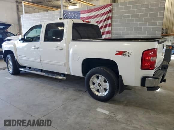 2012 Chevrolet Silverado 1500 LTZ with VIN 1GCPKTE71CF122304, listed as a Copart auction lot 85088215 with 217,510 mi miles and Salvage title. Bid and sale history available at DreamBid. Image 2.