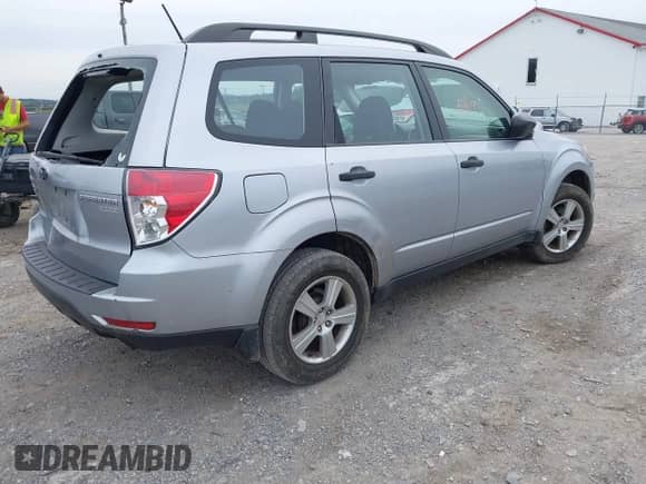 2012 Subaru Forester X with VIN JF2SHABC0CH420220, listed as a IAAI auction lot 43335419 with 127,338 mi miles and . Bid and sale history available at DreamBid. Image 4.