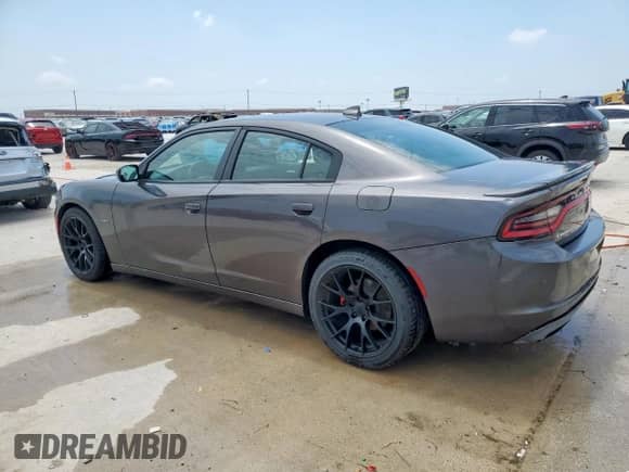 2018 Dodge Charger R/T with VIN 2C3CDXCT0JH169050, listed as a Copart auction lot 57631145 with 136,435 mi miles and Clean title. Bid and sale history available at DreamBid. Image 2.