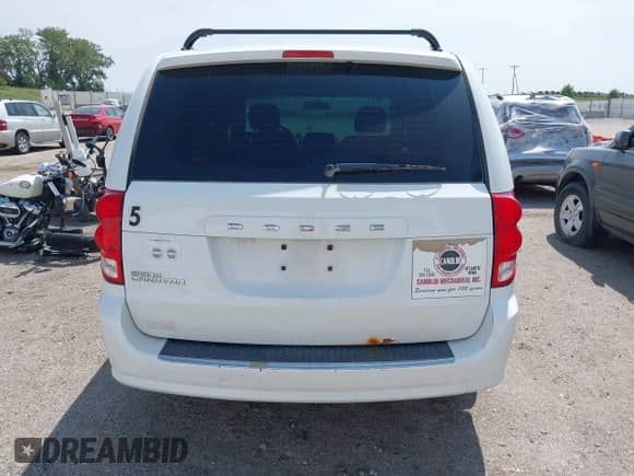 2014 Dodge Grand Caravan SE with VIN 2C4RDGBG3ER462595, listed as a IAAI auction lot 42401569 with 154,408 mi miles and . Bid and sale history available at DreamBid. Image 17.