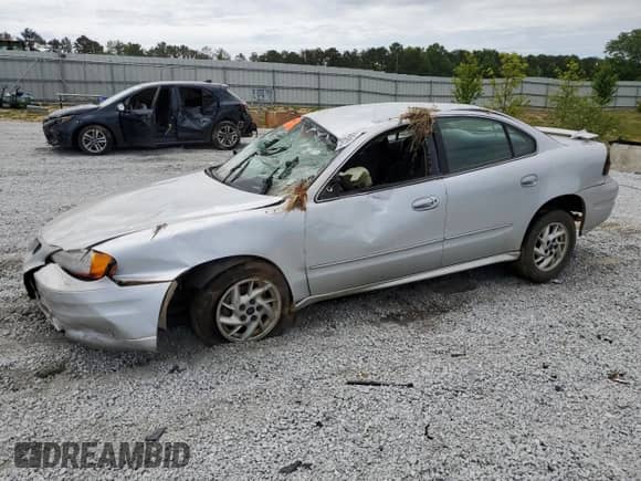 2004 Pontiac Grand Am SE с VIN 1G2NE52F64M679944, выставлен на аукционе Copart как лот 58166615 с пробегом Не указан миль и Списание • Salvage title. История ставок и продаж доступна на DreamBid. Изображение 1.