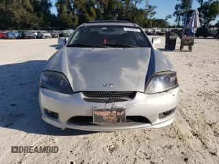 2005 Hyundai Tiburon GT с VIN KMHHN65F75U157864, выставлен на аукционе Copart как лот 75385814 с пробегом 198 670 миль миль и Списание • Salvage title. История ставок и продаж доступна на DreamBid. Изображение 5.