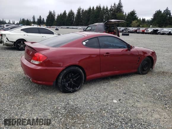 2006 Hyundai Tiburon GT с VIN KMHHN65FX6U228735, выставлен на аукционе Copart как лот 71986204 с пробегом 179 943 миль миль и Списание • Salvage title. История ставок и продаж доступна на DreamBid. Изображение 3.