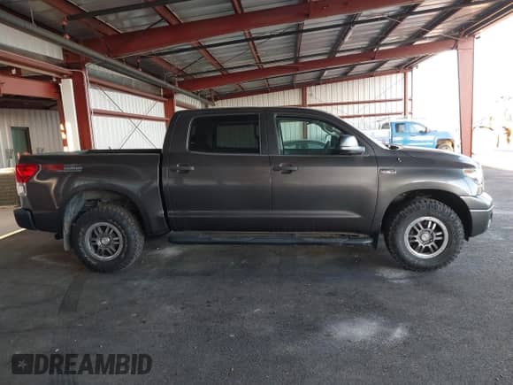 2013 Toyota Tundra with VIN 5TFDY5F16DX271794, listed as a IAAI auction lot 43238875 with 257,659 mi miles and . Bid and sale history available at DreamBid. Image 13.