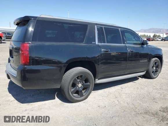 2015 Chevrolet Suburban LTZ с VIN 1GNSCKKC3FR542742, выставлен на аукционе Copart как лот 60916185 с пробегом 143 434 миль миль и Списание • Salvage title. История ставок и продаж доступна на DreamBid. Изображение 3.