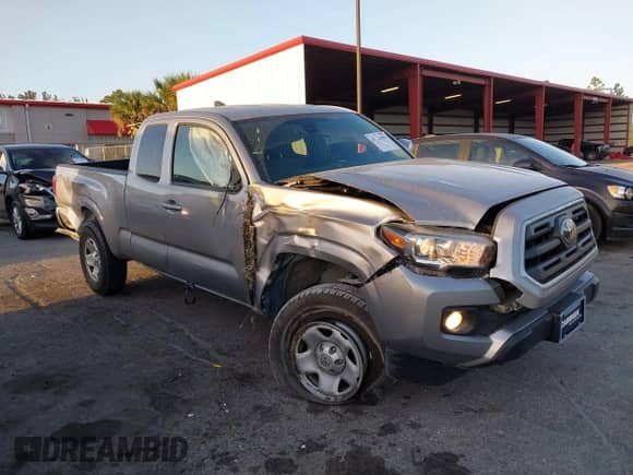 2018 Toyota Tacoma SR with VIN 5TFRX5GN8JX117075, listed as a IAAI auction lot 41723001 with 67,559 mi miles and . Bid and sale history available at DreamBid. Image 6.
