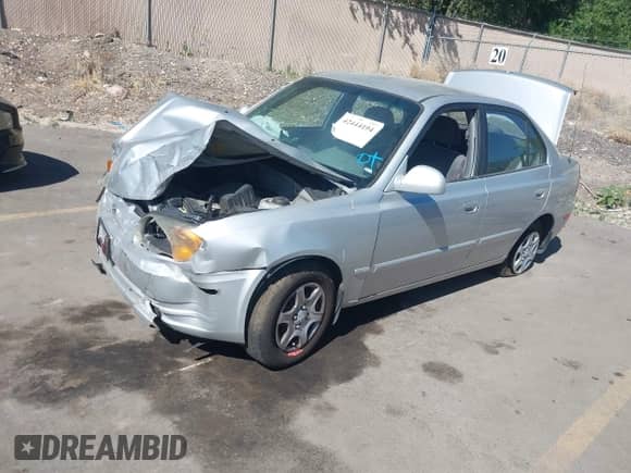 2004 Hyundai Accent GL z VIN KMHCG45C74U567268, wystawiony jako IAAI lot #42444194 z przebiegiem 182 380 mil mil oraz . Historia ofert i sprzedaży dostępna na DreamBid. Obrazek 2.